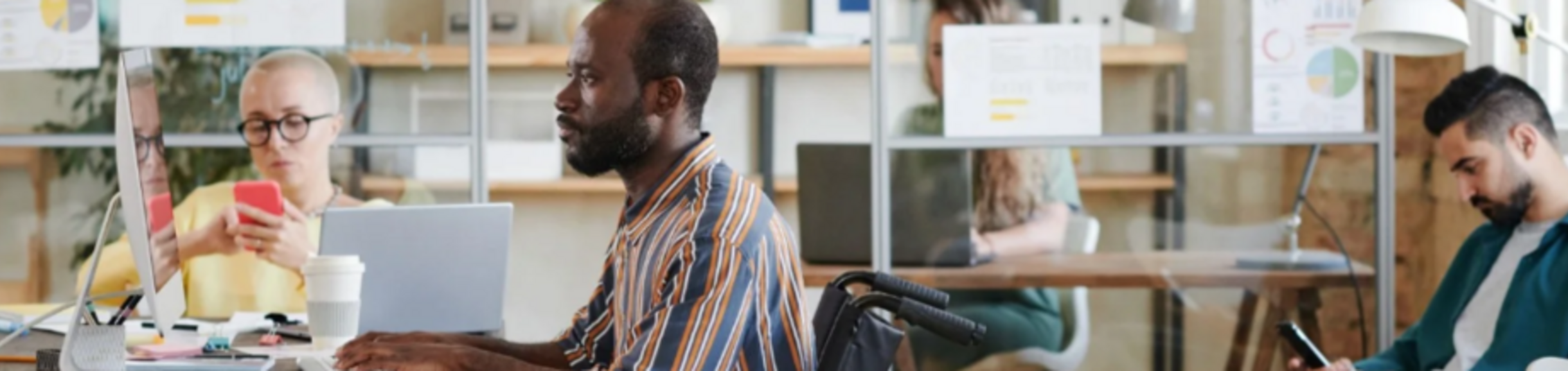 People working at a desk in the office