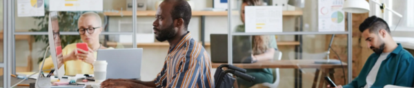 People working at a desk in the office